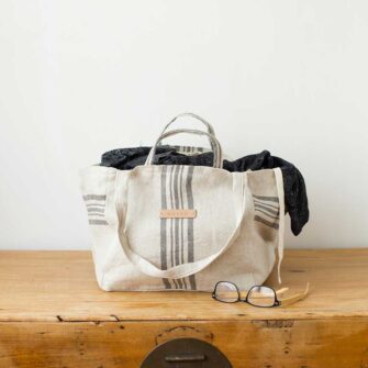 Swans Island's Medium Beach Bag - made by Govou from up-cycled vintage European grain sacks. Shown here in Natural with Black stripes.
