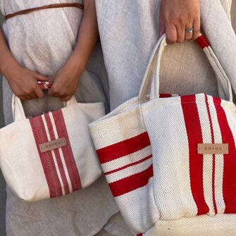 Swans Island Company's Large Beach Tote and Mini Beach Tote, made by Govou. Stitched from antique European grain sacks. Each up-cycled bag is unique! Shown here in Natural+ Red