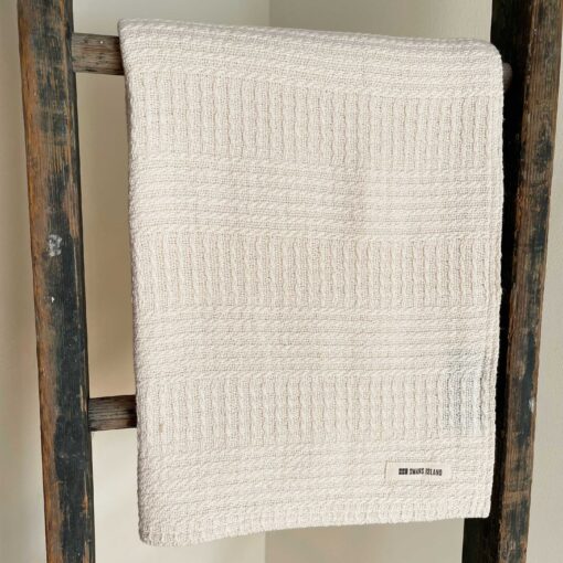 Swans Island Company's Caroline Throw. 100% Cotton throw with bands of woven texture in Natural undyed 100% American cotton.