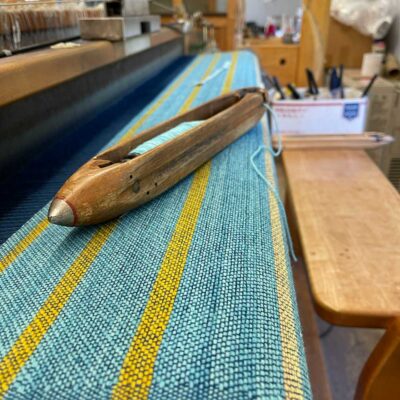Swans Island Co. Ocean Limited Edition Throws - Closeup of the loom with the #9 The Sunrise Throw in process.