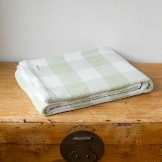 Swans Island Company's Cotton Gingham XL Check Blanket - woven in Maine on antique looms. Made with 100% soft American cotton. Shown here in Sage & White.