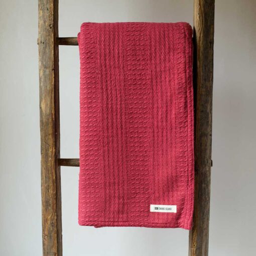 Swans Island Company's Caroline Throw. 100% Cotton throw with bands of woven texture. Made in USA with 100% American cotton. Shown here in Raspberry.