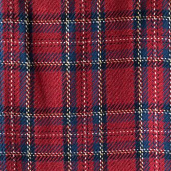 Swans Island Company's Traditional Plaid Throw and Blanket . Soft 100% Cotton blanket with a dyed-in-the-yarn classic tartan plaid pattern. Made in USA with 100% American cotton. Shown here in Red. Swatch