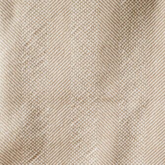 Swans Island Company's Savannah Blanket. Soft 100% Cotton blanket with woven herringbone texture. Made in USA with 100% American cotton. Shown here in Tan. Swat