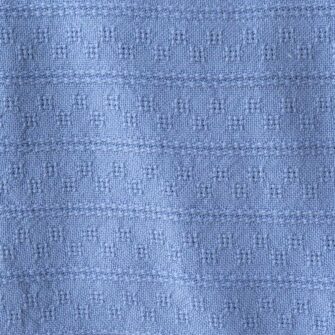 Swans Island Company's Bedford Cotton Blanket. Soft 100% Cotton blanket with a small banded check texture. Made in Maine, USA with American cotton. Shown here in Light Blue. Swatch