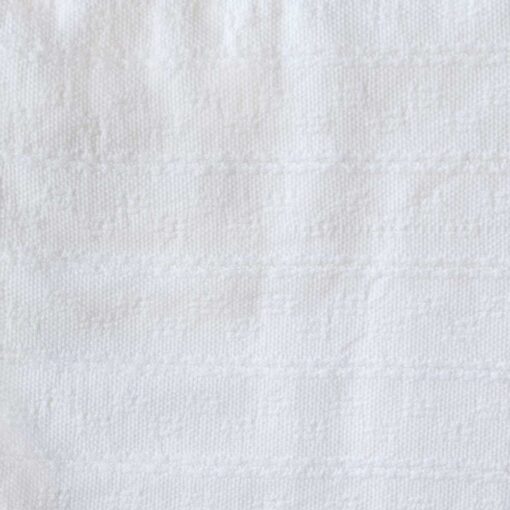 Swans Island Company's Bedford Cotton Blanket. Soft 100% Cotton blanket with a small banded check texture. Made in Maine, USA with American cotton. Shown here in White. Swatch