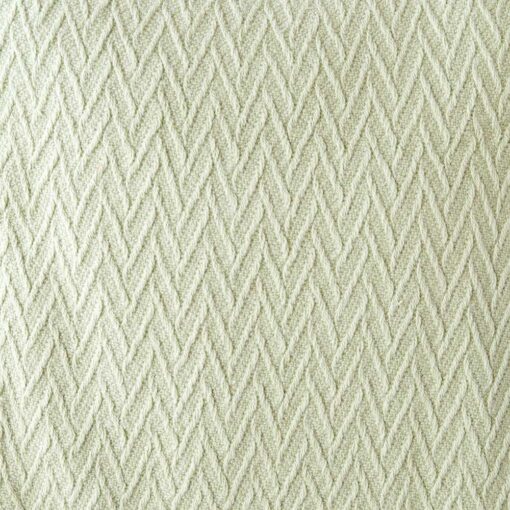 Swans Island Company's Charisma Blanket. Soft 100% Cotton blanket with woven herringbone texture. Made in USA with 100% American cotton. Shown here in Celadon. Swatch