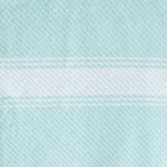 Swans Island Company's Cotton Summer Twill Blanket. Soft 100% Cotton blanket with yarn-dyed woven stripes. Made in USA with 100% American cotton. Shown here in Saltwater. Swatch