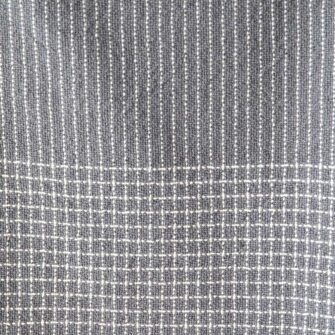 Company's Pinstripe Linen Throw. Made in USA, has an allover subtle pinstripe design highlighted with a checked border. Linen Cotton blend. Shown here in Charcoal color. Swatch