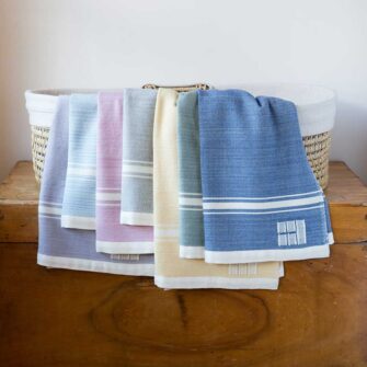 Swans Island Company's Grace Modern Baby Blankets. Handwoven in Maine with soft organic merino wool yarns in an assortment of beautiful hand-dyed colors.