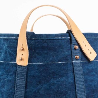 Swans Island Company's Small East West Tote in heavy cotton canvas - by Immodest Cotton. Dark Indigo. Detail of handles.