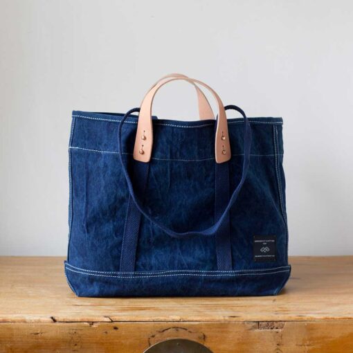 Swans Island Company's Small East West Tote in heavy cotton canvas - by Immodest Cotton. Shown here in Dark Indigo.